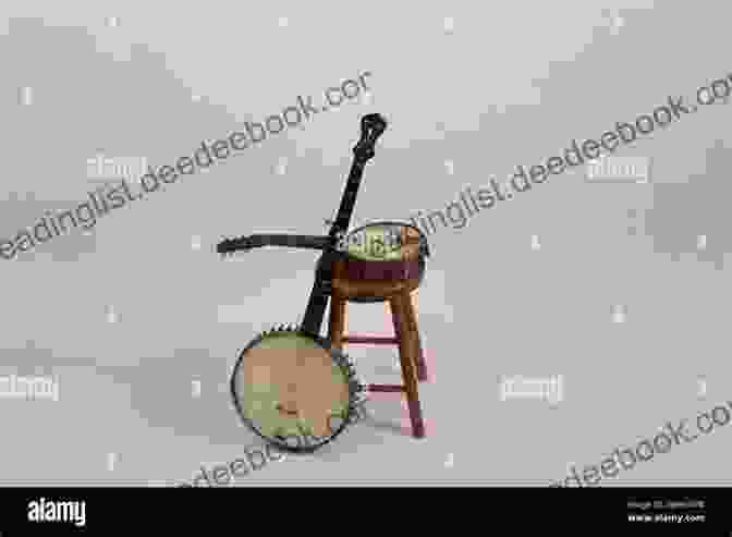 A Banjo Resting On A Wooden Surface, With A Close Up Of The Fretboard And Strings More Easy Banjo Solos: For 5 String Banjo