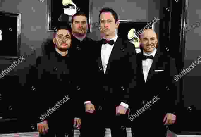 Band Members Matt Heafy, Corey Beaulieu, Paolo Gregoletto, And Alex Bent Standing Together, Looking Determined. Trivium The Mark Of Perseverance